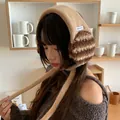 Cozy Korean style plush striped earmuffs for winter warmth shown on a young female model - One Size / Khaki
