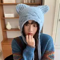 Cute blue knitted beanie with cat ears and protective ear flaps for winter warmth - 56-60cm / Blue
