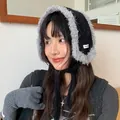 Stylish Asian woman wearing black plush earmuff hat with grey fur trim and knit ties for winter - One Size / Black