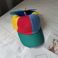 Detail view of a colorful patchwork kids baseball cap with a rotating propeller. - Adjustable / Kids Style (43-50cm)