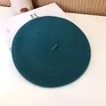 Close-up detail of the teal wool beret showing its soft felt texture and vintage design - 55-58cm (Stretchy) / Beret / Ink Blue