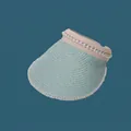 Close-up of mint green straw sun visor hat with elegant pearl decorations for women - 55-59cm / Light Green