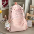 Pink cartoon backpack for teen girls with sweet pony patterns in a lifestyle setting - Pink with Pendant