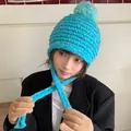 Blue knitted winter hat for women featuring colorful flecks and a soft fluffy pom-pom - 56-59cm (Elastic) / Blue