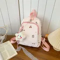 Close-up of a cute pink student backpack featuring bear prints and a star charm - Pink Bear (With Pendant)