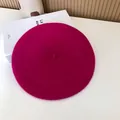 Top-down view of a vibrant magenta wool beret showing soft felt texture and classic design - 55-58cm (Stretchy) / Beret / Deep Rose Red