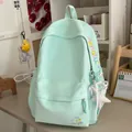 Close-up of a mint green backpack with colorful mengtu embroidery and star charm. - With Pendant / Green (With Pendant)