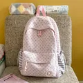 Close-up detail of a pink star-patterned backpack for school and travel - No Pendant / Pink