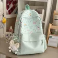 Mint green student backpack with cute cartoon pony prints in a cozy room setting - Green with Pendant