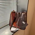 Detailed view of a vintage brown grid pattern tote bag set with matching small pouch accessory - Large Capacity Grid Tote Bag Set / Coffee