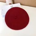 Close-up detail of a classic burgundy wool beret with soft felt texture for autumn winter style. - 55-58cm (Stretchy) / Beret / Wine Red