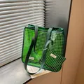 Close-up of a minimalist green mesh tote bag with a matching small pouch on a windowsill - Large Capacity Grid Tote Bag Set / Green