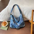 Vintage blue wash denim shoulder bag with motorcycle jacket zipper and buckle details - Light Blue