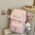 Macro view of a stylish pink backpack with star pattern and cute plush keychain - With Pendant / Pink