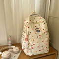 Cream polka dot backpack featuring cute cat embroidery and plush bear keychain accessory. - Yellow