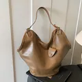 Large capacity lazy style khaki brown hobo shoulder bag with textured faux leather finish - Brown