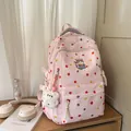 Detailed view of pink sweet polka dot backpack with cute cat embroidery and bear charm - Pink