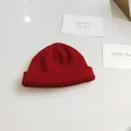 Vibrant red knit beanie hat featuring classic ribbed texture and a short cuff design - 54-58cm / Burgundy
