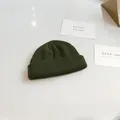 Close-up of dark green knitted docker cap showing its vertical rib texture detail. - 54-58cm / Army Green