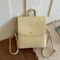 Chic cream textured backpack with minimalist flap design and top handle - Yellow