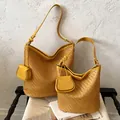 Stylish yellow woven leather bucket hobo bag featuring a matching mini accessory pouch - L / Yellow