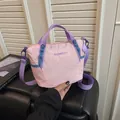 Women's pink grid crossbody bag with purple straps and adjustable handles for daily use - Pink