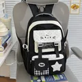 Vista frontal de una linda mochila escolar en blanco y negro con orejas de gato - Negro