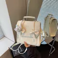 Zaino chic color crema in stile college con simpatico ciondolo a coniglio e fiocchi - Stile Con Ciondolo / Beige Con Ciondolo