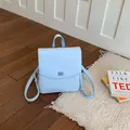 Minimalist light blue faux leather backpack for women with top handle and embossed texture - Blue