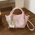 Retro pink leather bucket crossbody bag with decorative pearl bow and tulip charms - With Pendant / Pink with Pendant