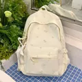 Fresh cream-colored floral backpack for students featuring a cute star charm detail - With Charm / White