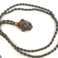 Natural brown raw crystal stone pendant in black hand-woven mesh net bag necklace - Petrified Wood / Black