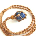 Natural blue lapis lazuli stone pendant featuring a handmade woven rope net necklace design - Lapis Lazuli / Brown
