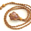 Hand-woven adjustable brown hemp rope necklace featuring a polished pink crystal stone pendant - Red Strawberry / Brown