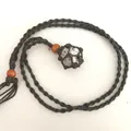 Handmade woven mesh necklace featuring a natural white and black spotted crystal stone pendant - Rock / Black