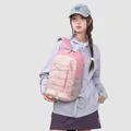 Detailed view of a stylish pink outdoor sports backpack worn by a female model for travel - Sakura Pink