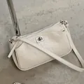 Elegant cream French minimalist crossbody bag with textured leather and silver clasp - Off White