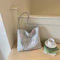 Close-up detail of floral embroidery on light blue lace Chinese style shoulder bag - Gray