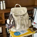 Elegant cream-colored faux leather mini backpack with a stylish dachshund dog charm - With Pendant / Off White