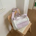 Lavender and white star pattern fitness travel duffle bag displayed on a wooden chair - Purple