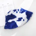 Detailed macro view of soft plush blue and white cow print bucket hat for winter warmth - 55-58cm / Blue