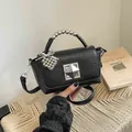 Fashionable black textured crossbody bag with silver bead handle and heart charm - With Charm / Black