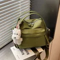 Stylish green checkered crossbody bag featuring a cute white dog plush pendant for women - With Charm / Green