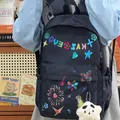 Trendy navy blue nylon backpack with colorful graffiti prints and star plush charm - Black