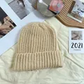 Macro view showing the soft thick knit texture of this beige oversized winter beanie hat - 55-62cm (Elastic) / New Oversized Knit Hat (AC8924) / Beige