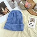 Detailed view of a soft blue chunky knit beanie hat presented in a cozy lifestyle setting - 55-62cm (Elastic) / New Oversized Knit Hat (AC8924) / Light Blue