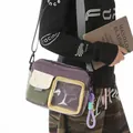 Close-up of a lightweight sport crossbody bag with a transparent window and HIYA embroidery - With Charm / Purple