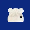 Close-up of cream knitted beanie with cute bear ears and black woven label - 48-58cm / White