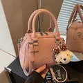 Pink pebbled leather Boston bag with cute plush poodle charm and adjustable shoulder strap. - With Bear Charm / Pink