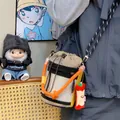 Close-up of a stylish bucket bag with mesh detail and vibrant orange rope handle. - Khaki (With Pendant)